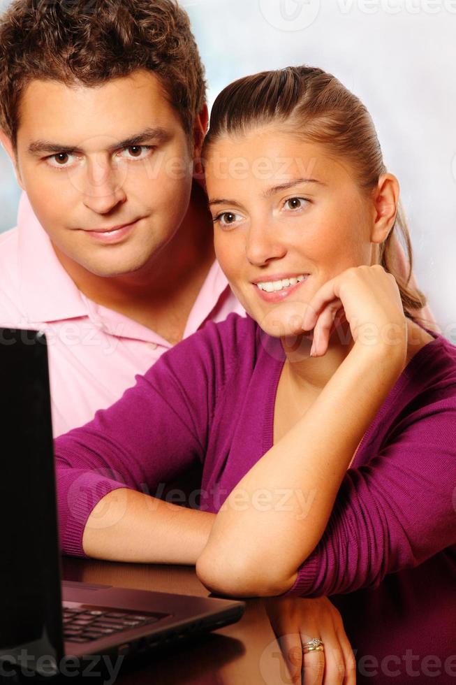 Young married couple searching the Internet photo