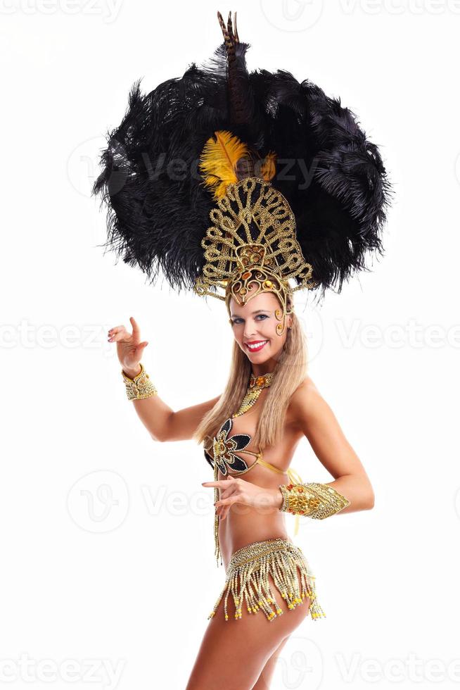 Brazilian woman posing in samba costume over white background photo