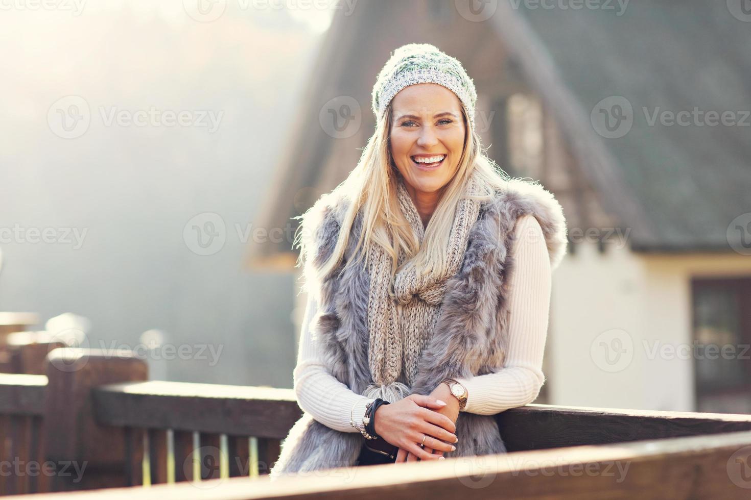 Happy woman enjoying winter season outdoors photo