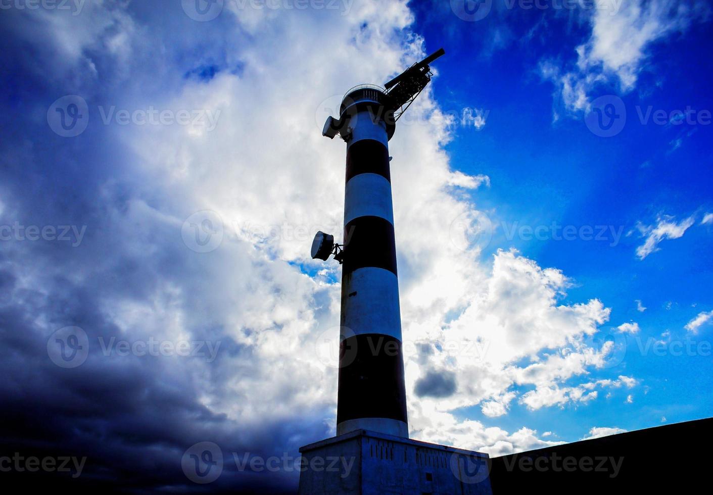 Lighthouse by the sea photo