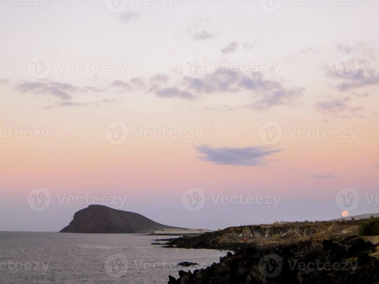 Sunset over the ocean photo