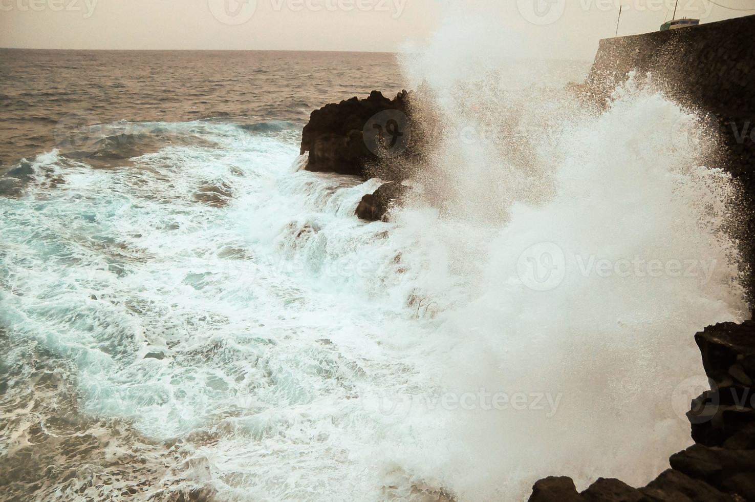 Strong Waves hitting the rocks photo