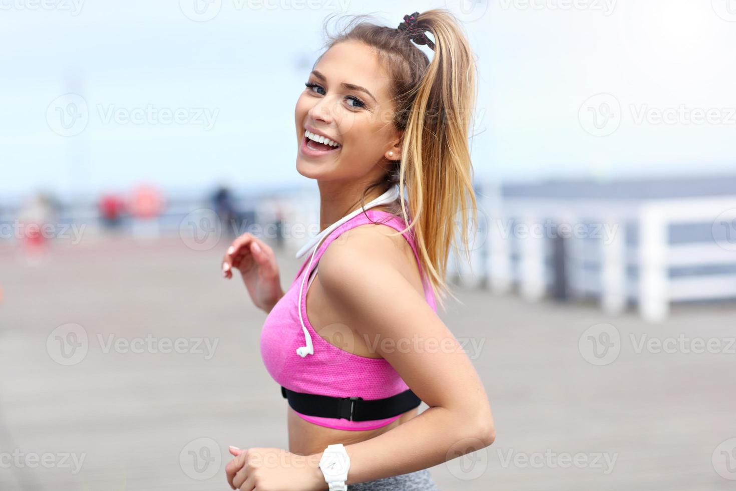 Woman jogging on the beach photo