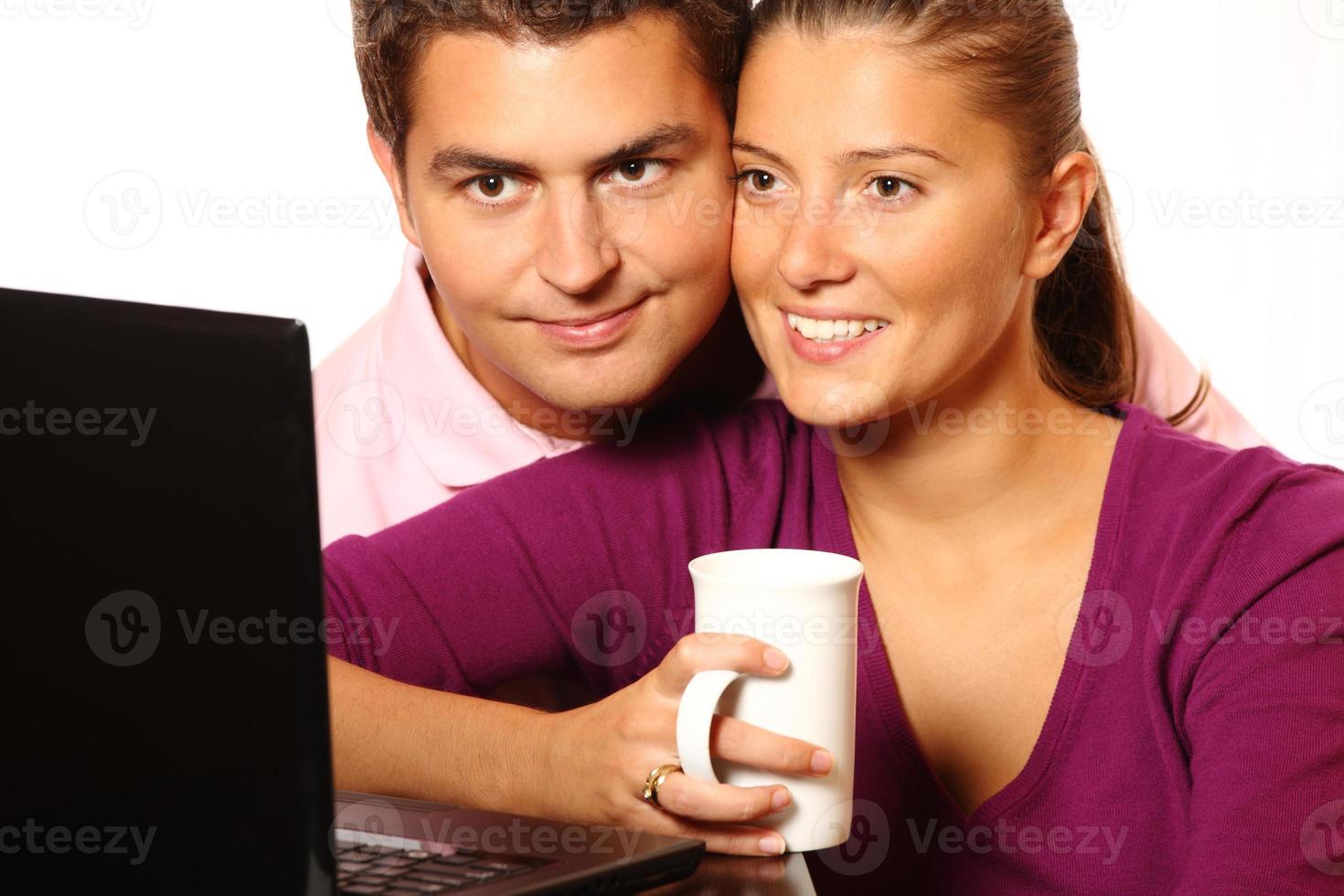 Young married couple browsing the Internet photo