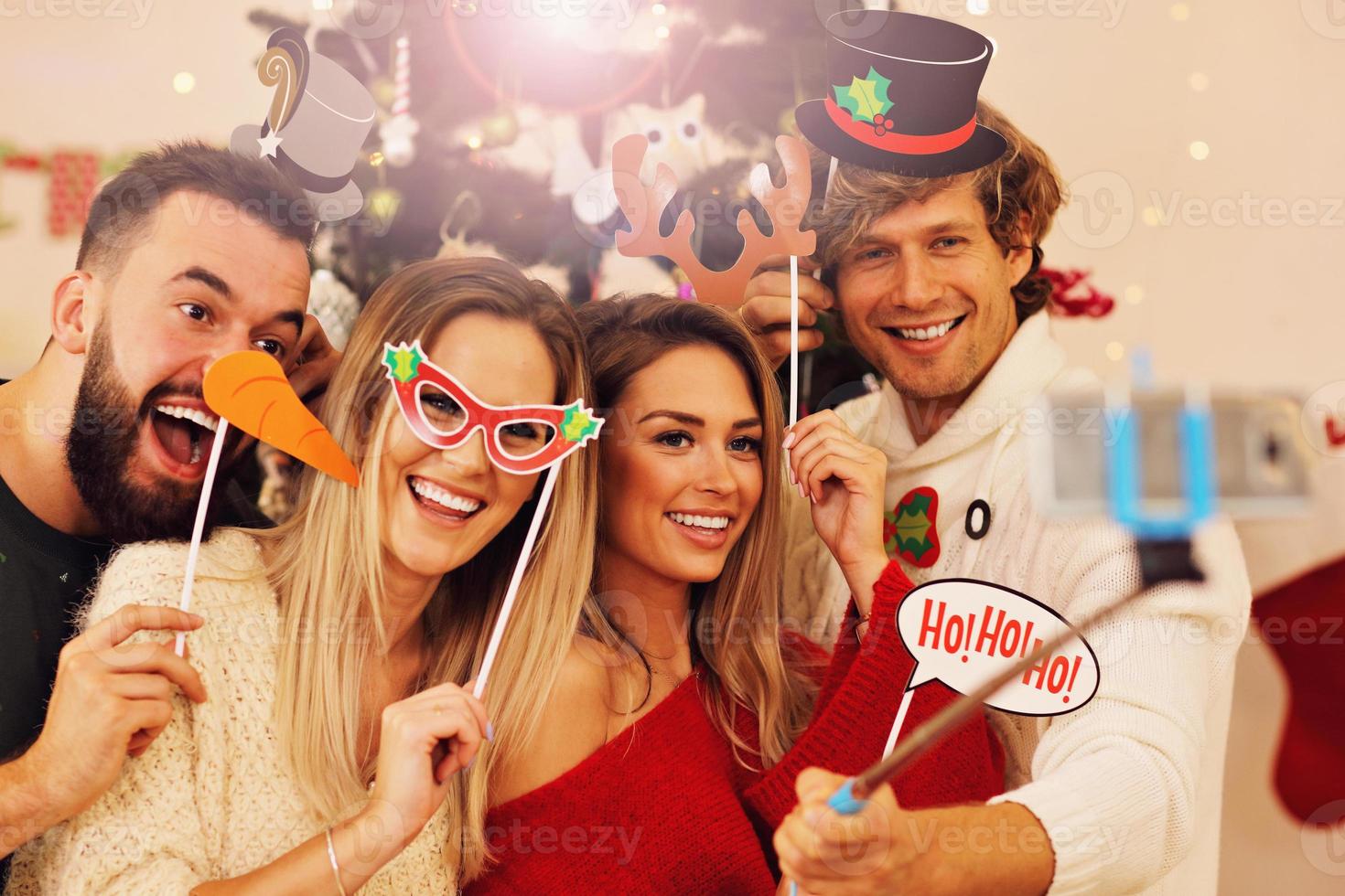 Group of friends having fun during Christmas photo