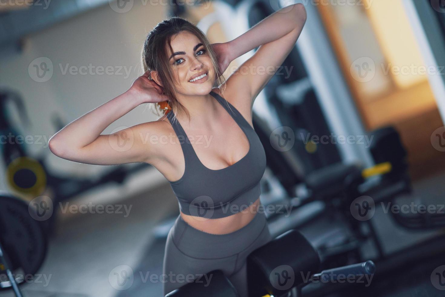 Adult woman working out in a gym photo