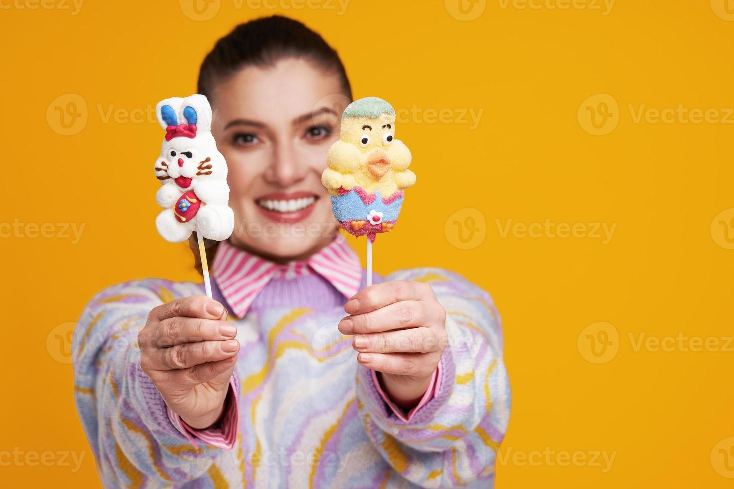 Studio shots of beautiful young woman over yellow background photo
