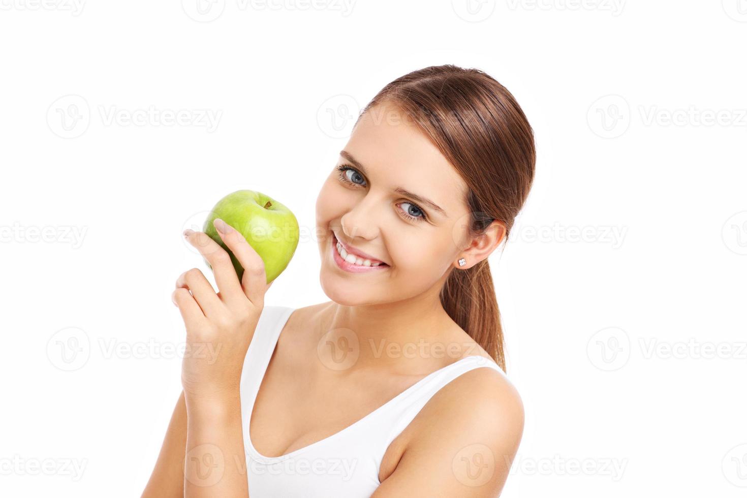 Pretty woman holding green apple photo