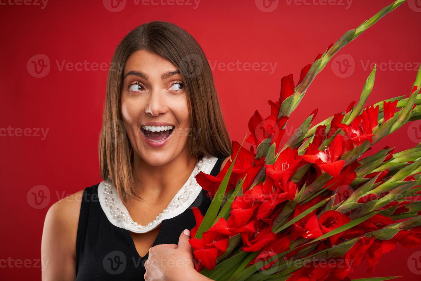 Adult woman with flowers over red background photo