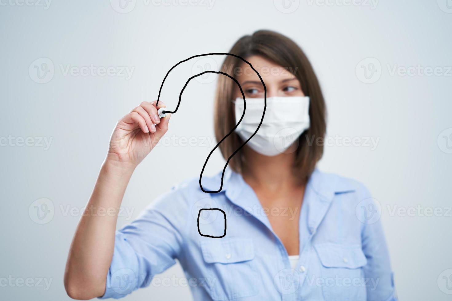 Attractive woman wearing protective mask isolated over white background photo