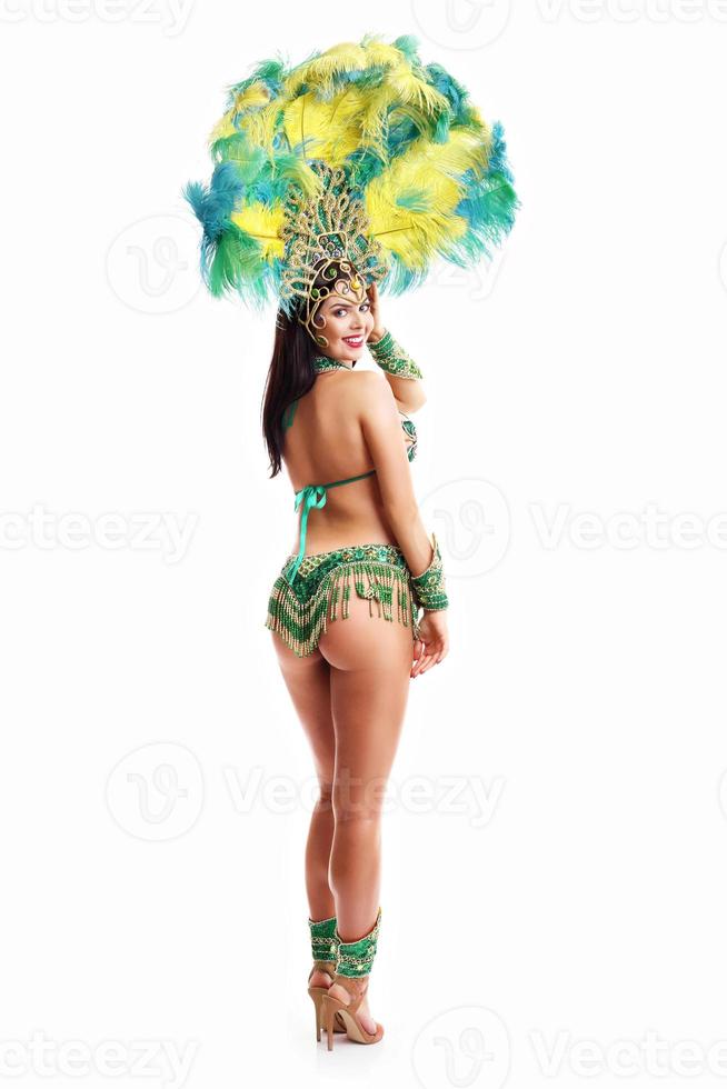 Brazilian woman posing in samba costume over white background photo