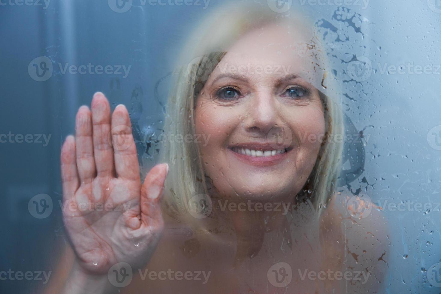 Senior woman taking shower at home 15853401 Stock Photo at Vecteezy