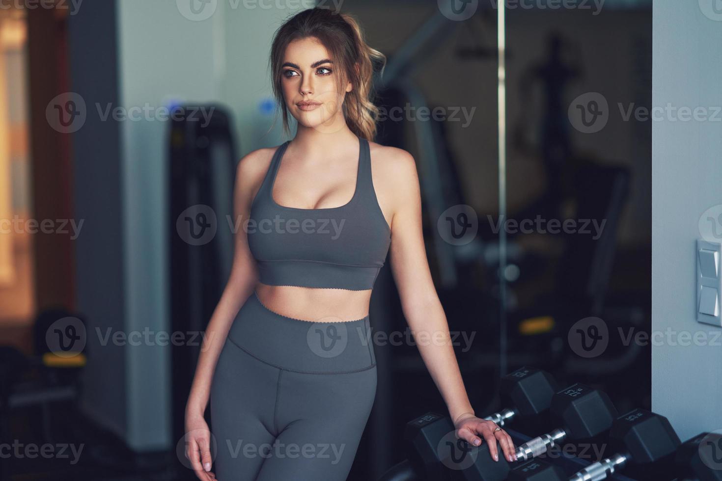 Adult woman working out in a gym photo