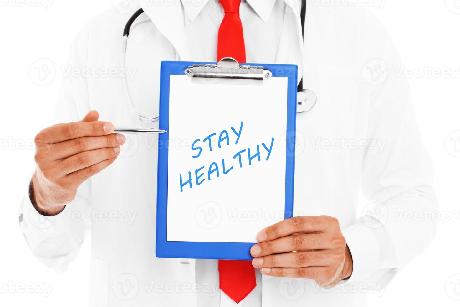 Midsection of a doctor pointing at stay healthy inscription photo