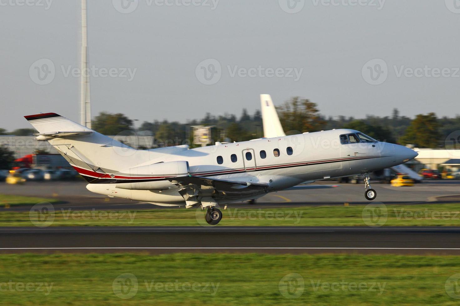 business jet taking off photo