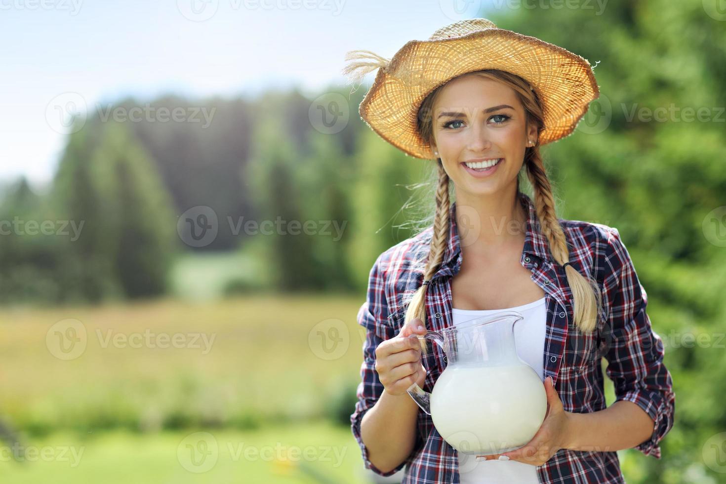 Young woman with fresh organic milk photo