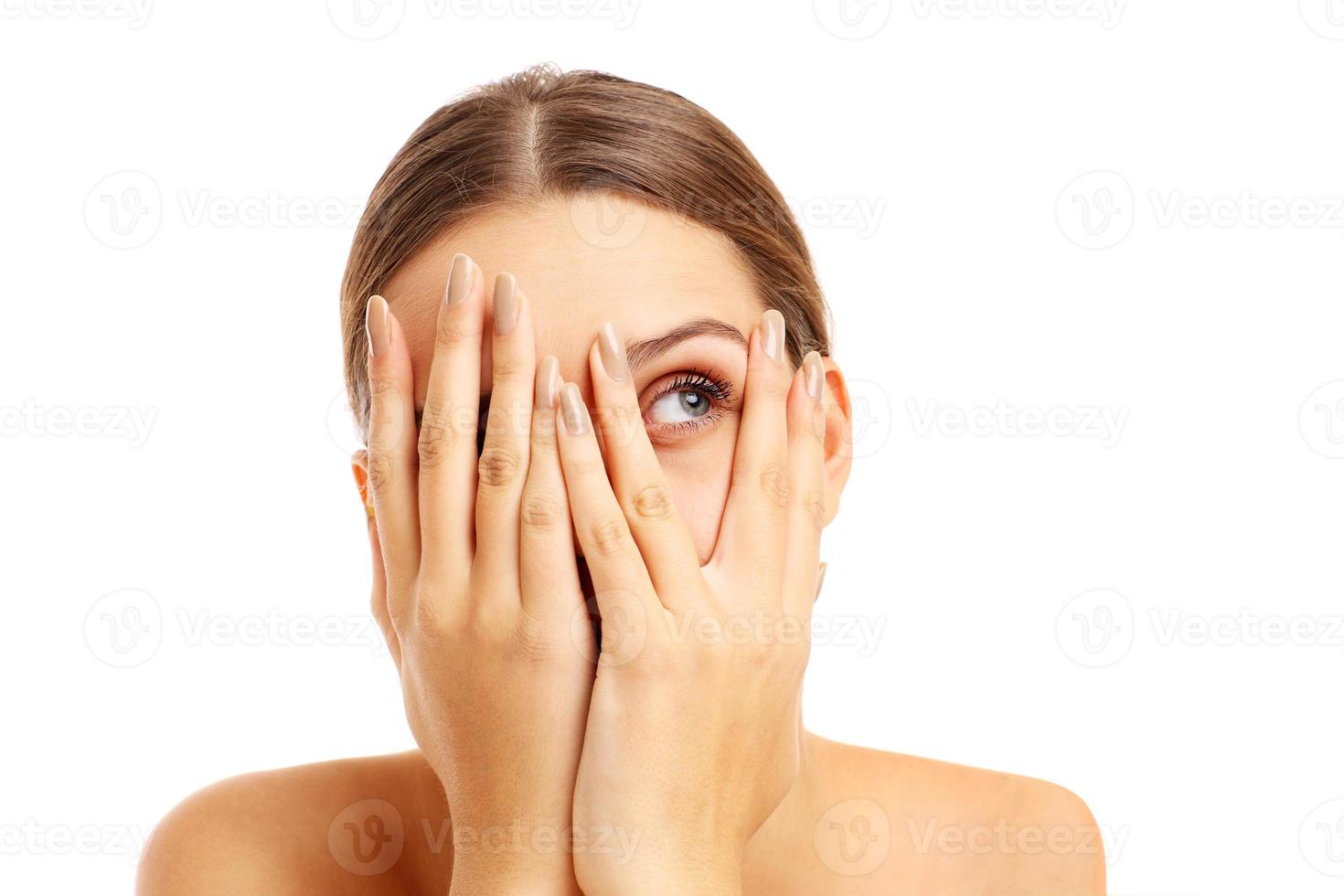 Terrified woman covering her face photo