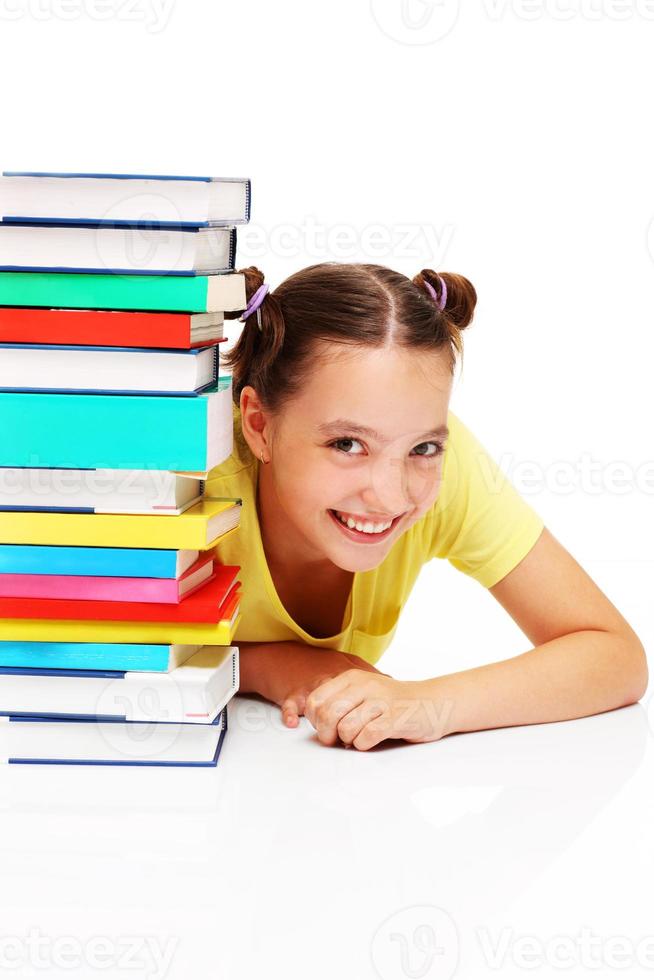 Happy schoolgirl and books photo