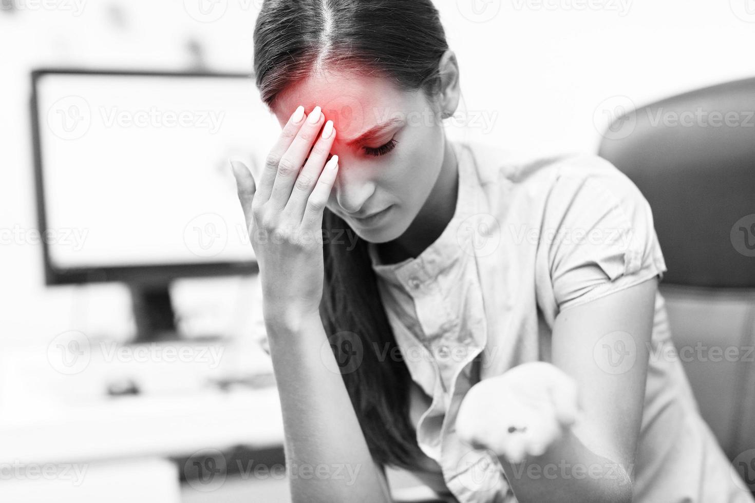 Businesswoman suffering from headache photo