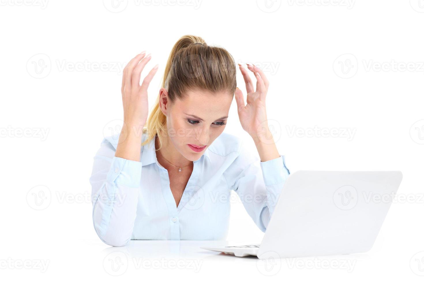Businesswoman working on laptop photo