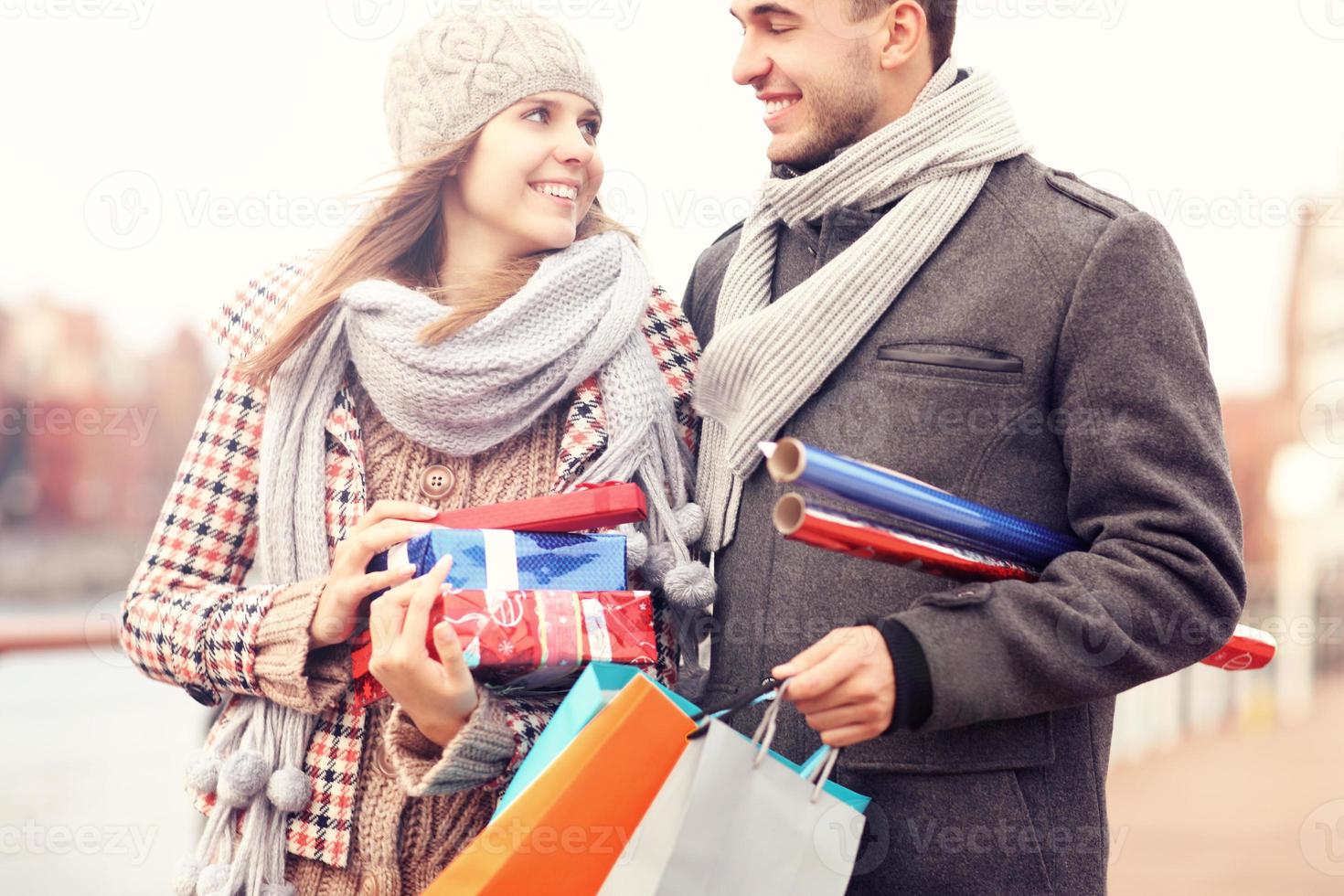 Beautiful couple with Christmas presents photo