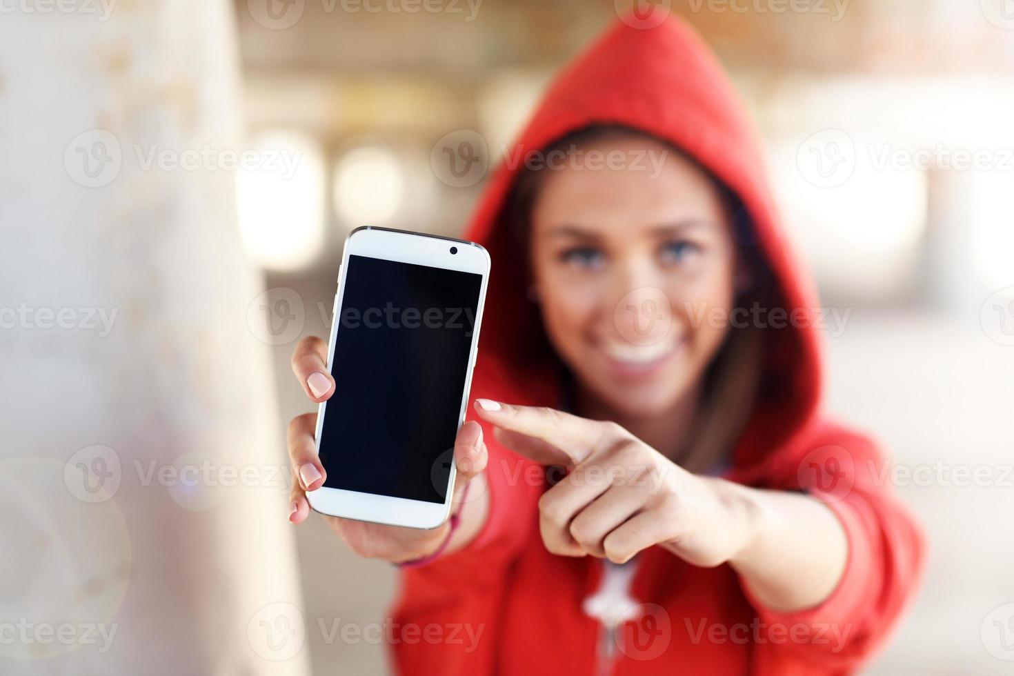 Woman with smartphone on the beach photo