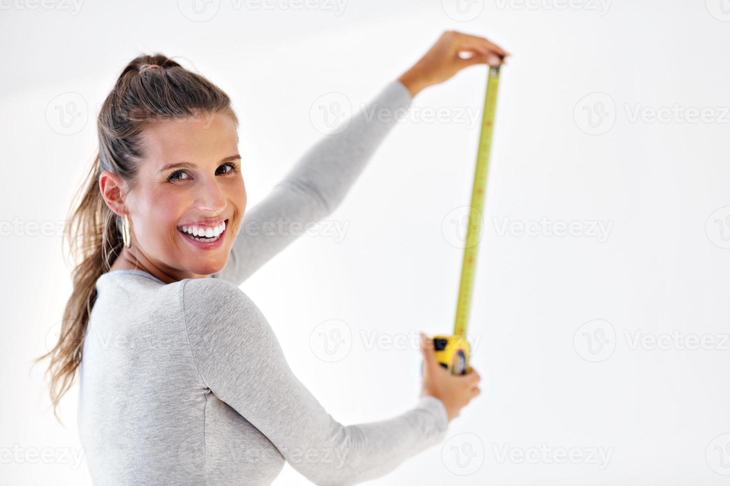 Mature woman doing home improvements photo