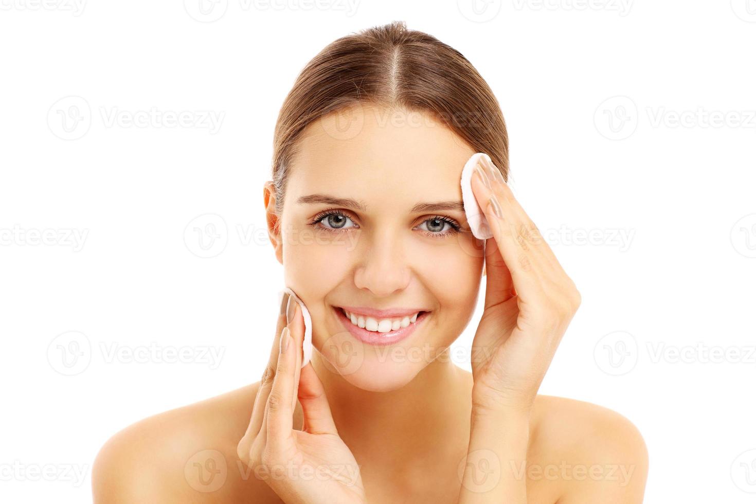 Woman cleaning face photo
