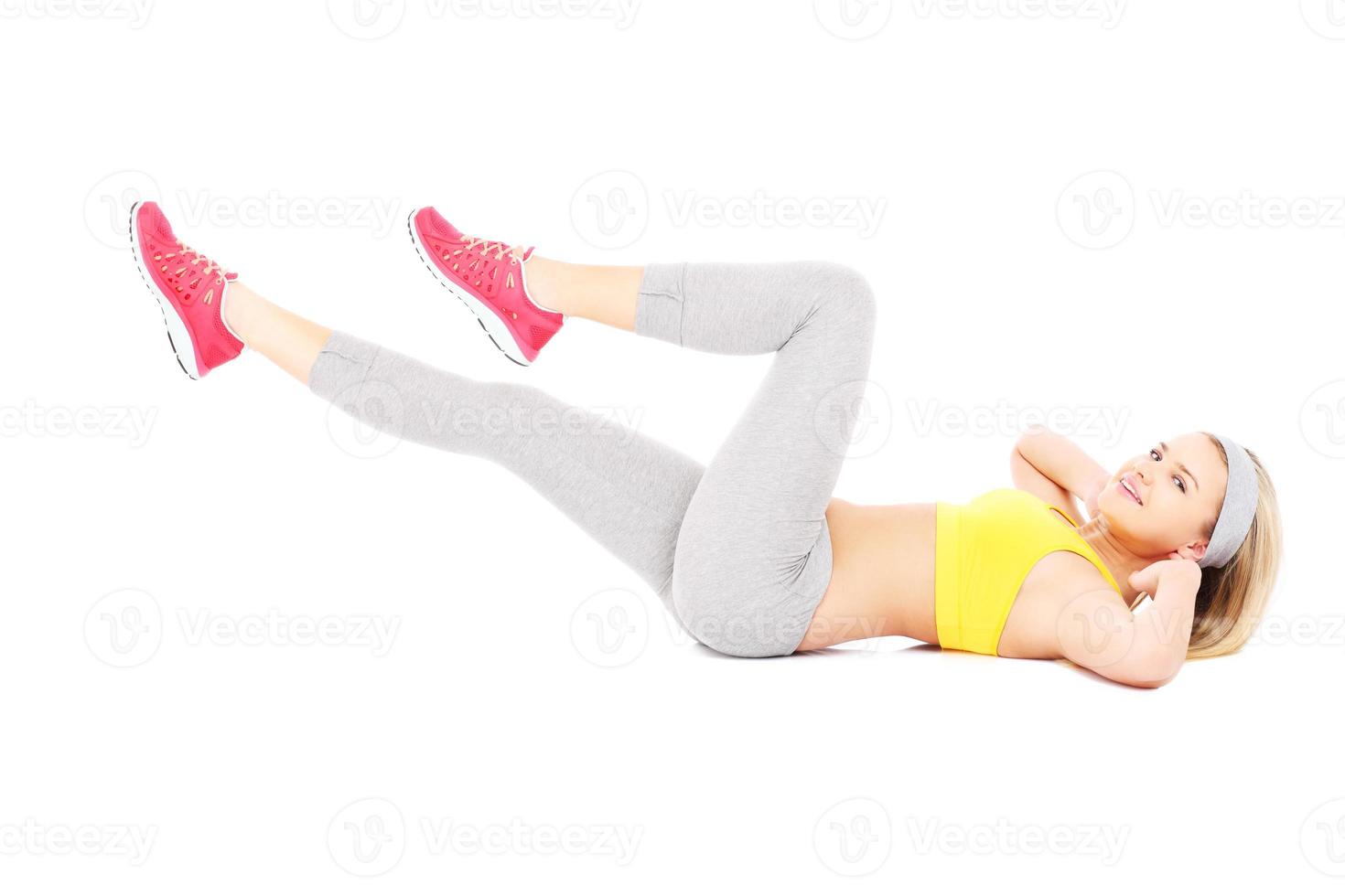 Woman doing sit-ups photo