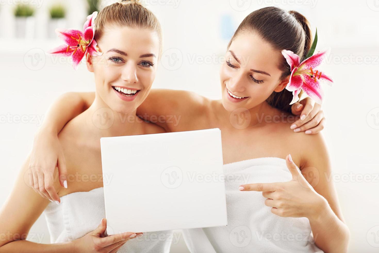 Two beautiful women in spa photo