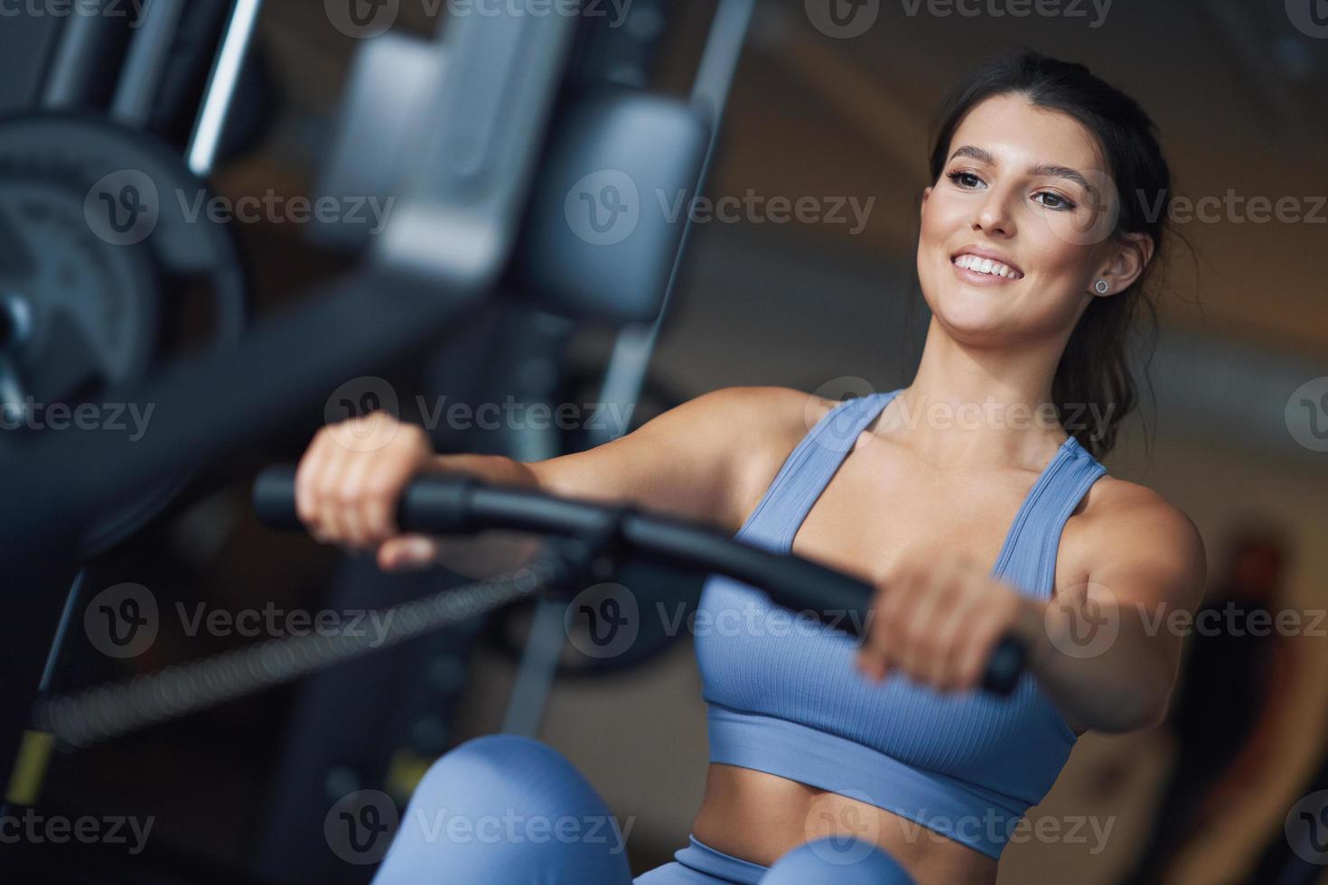 Adult woman working out in a gym photo