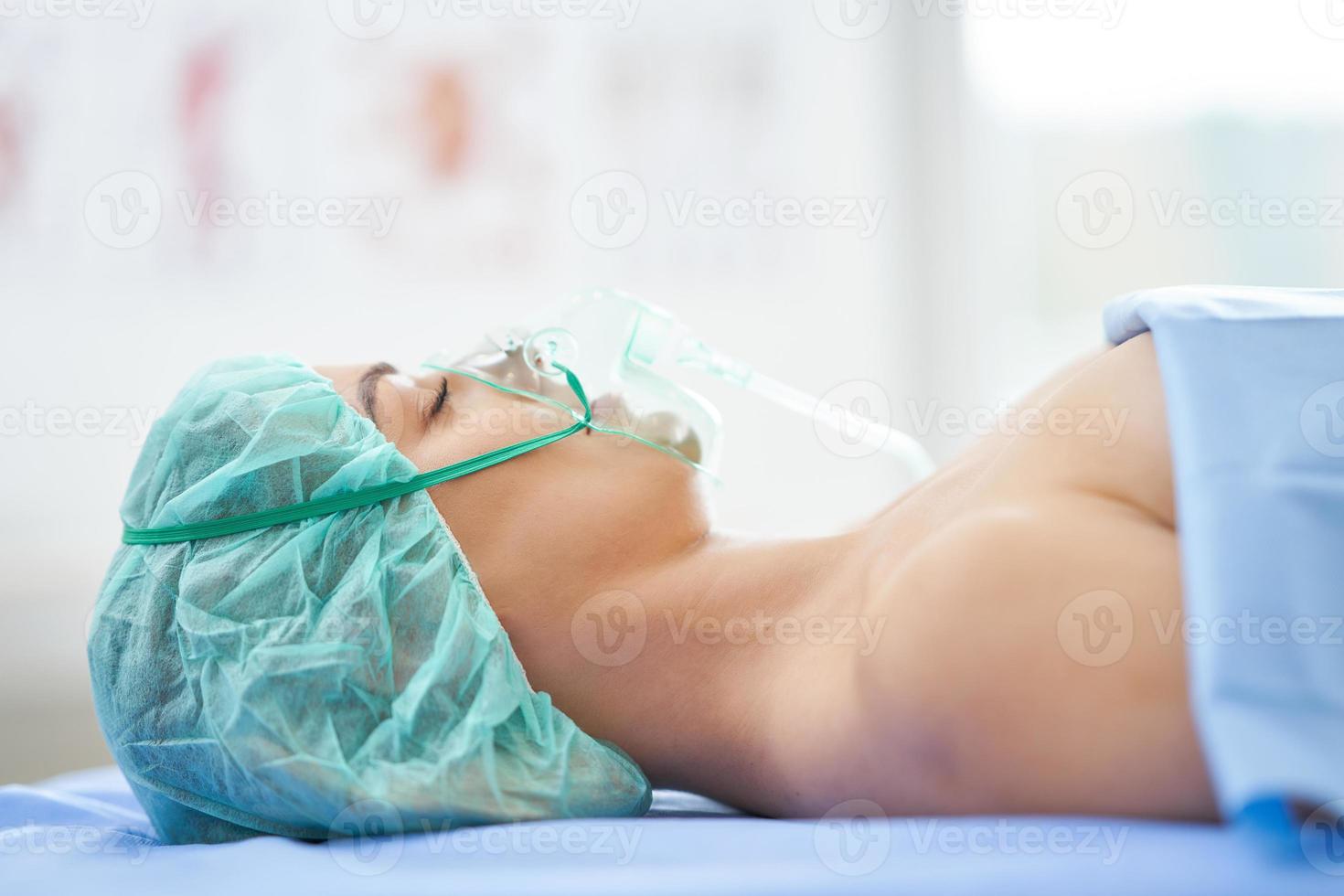 Female patient having respiratory therapy recovering in the hospital photo