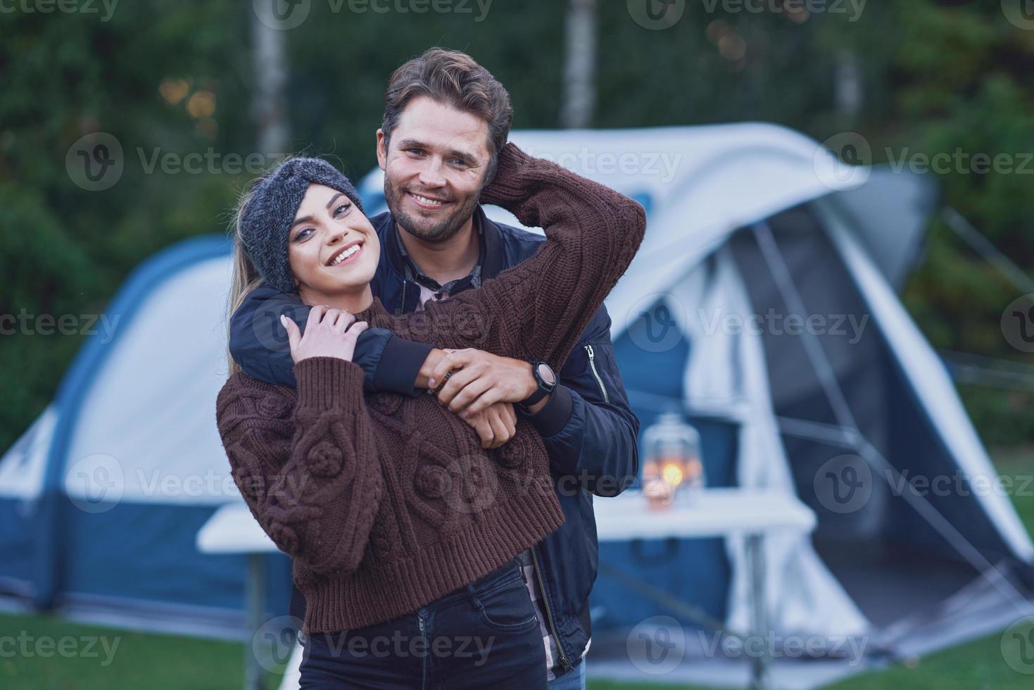 Young nice couple having fun on camping photo