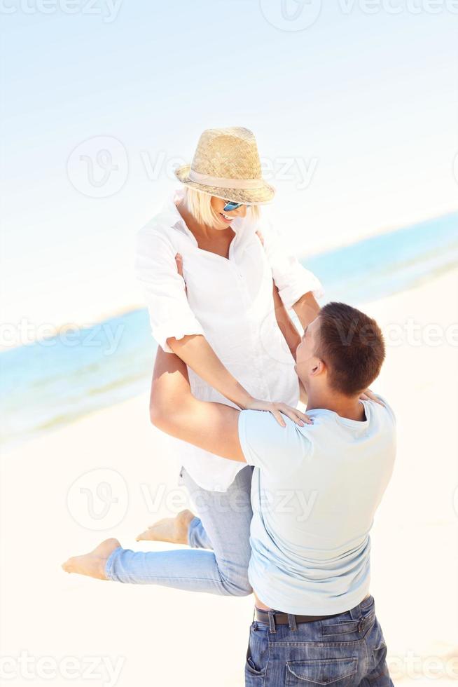 Joyful couple at the beach photo