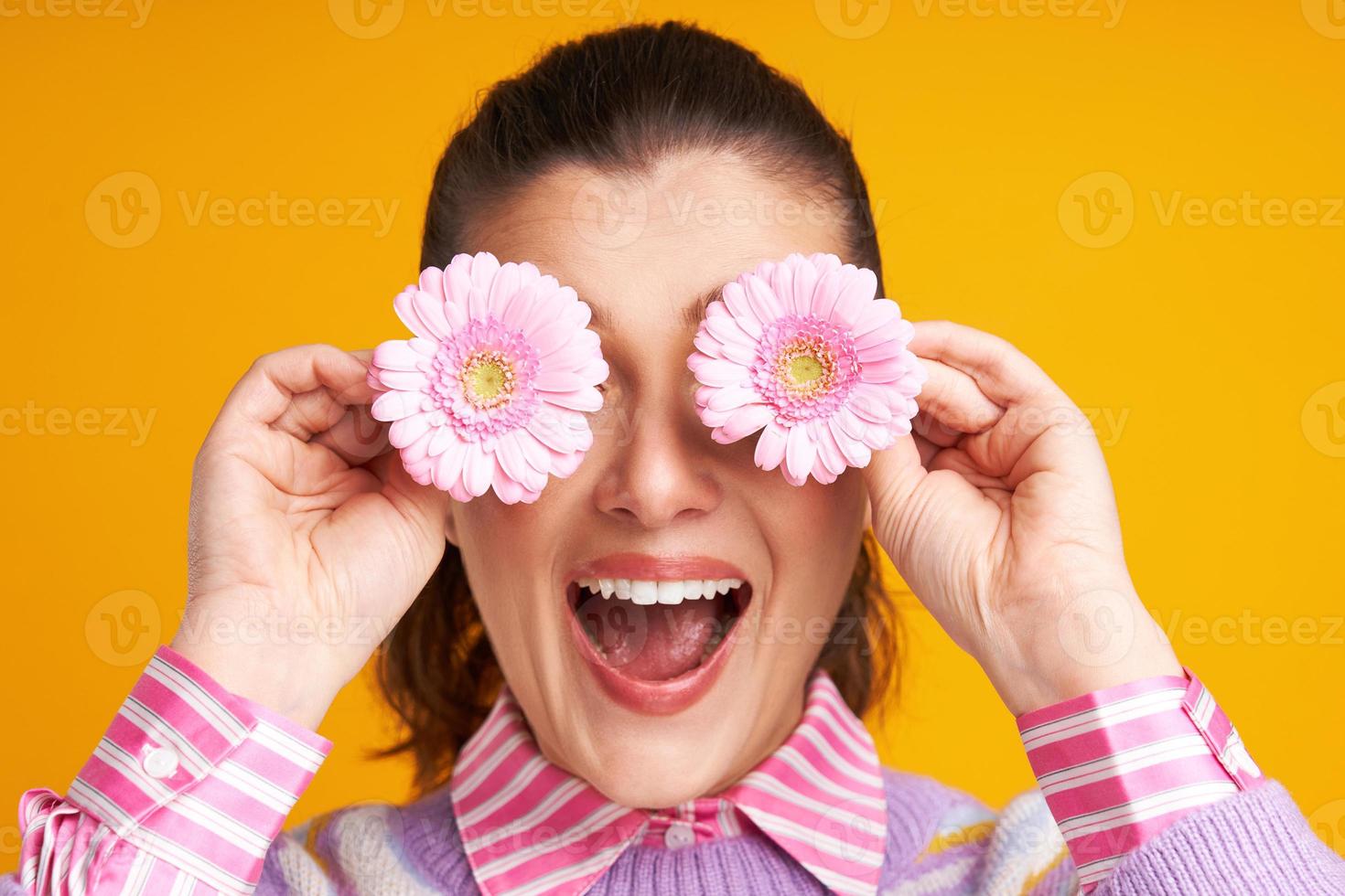 Studio shots of woman over yellow background easter style photo