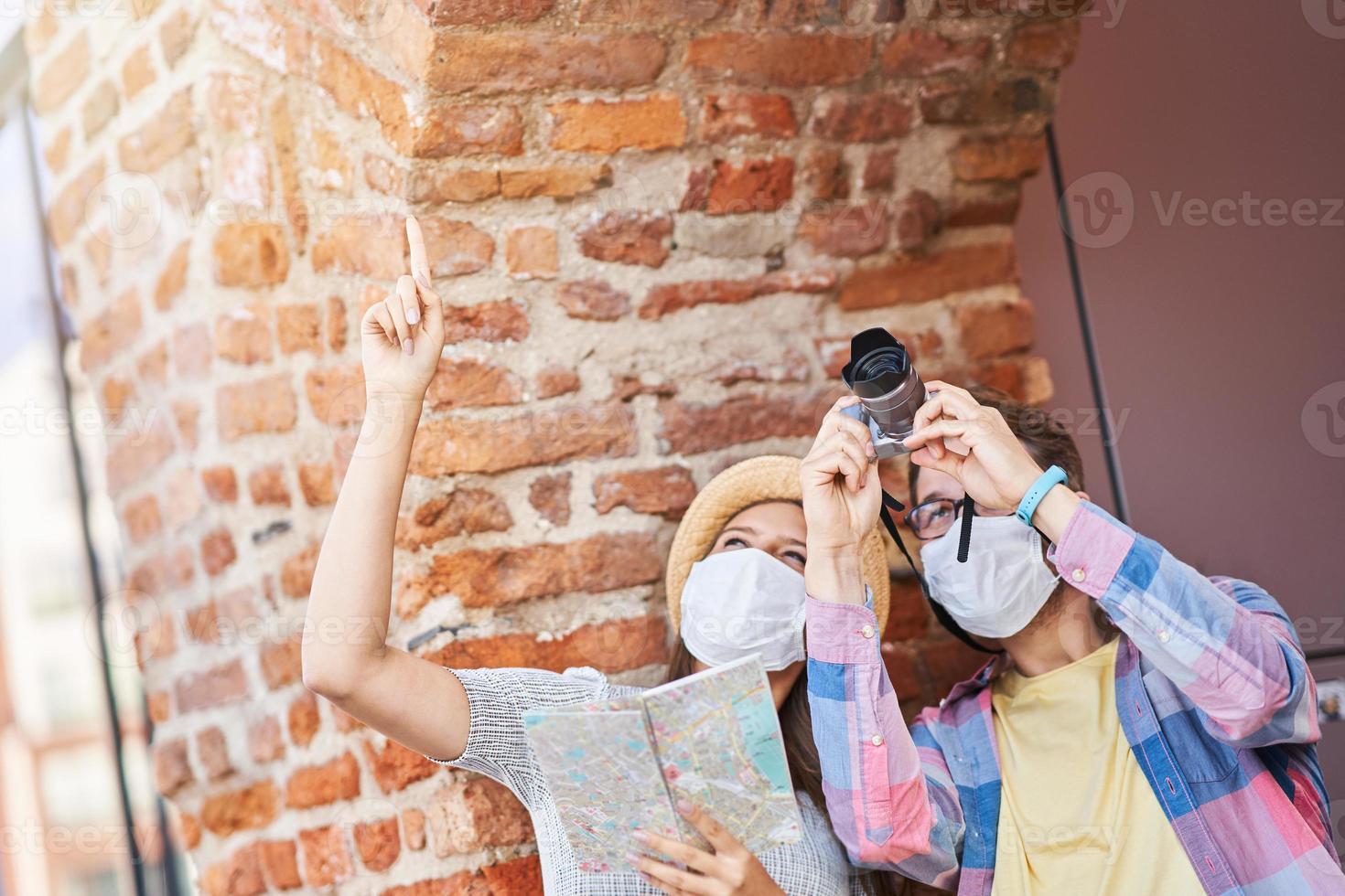 Adult tourists in masks sightseeing Gdansk Poland photo