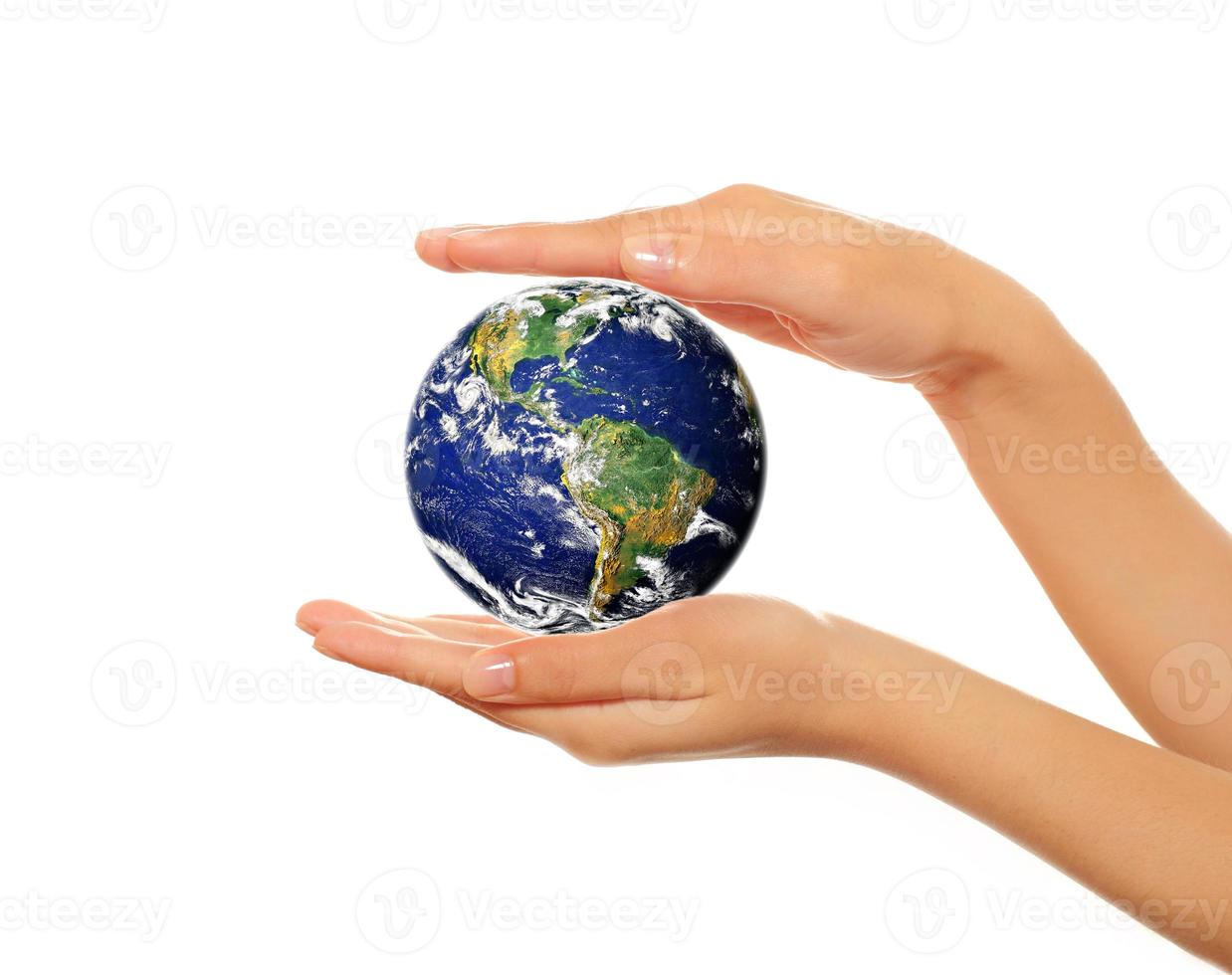 Hands holding Earth photo
