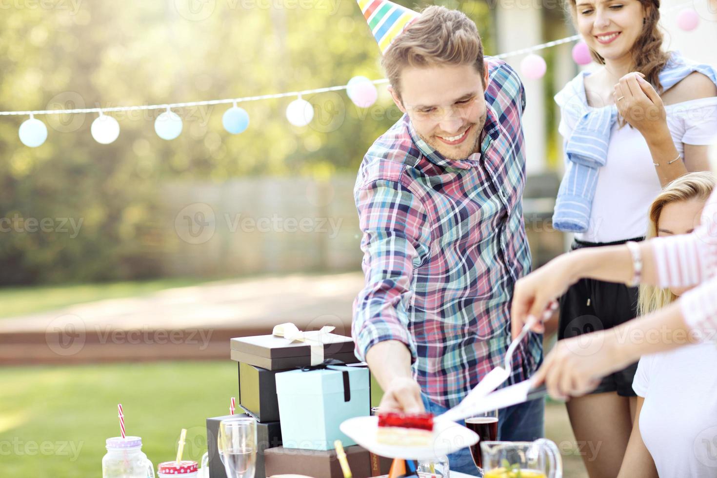 Group of friends having fun at birthday party photo