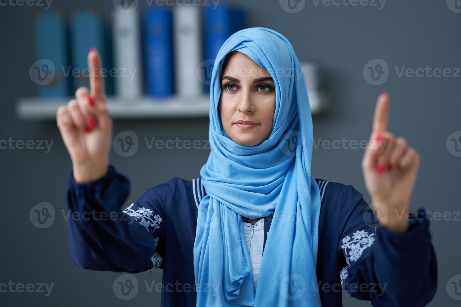 Muslim female student learning at home photo