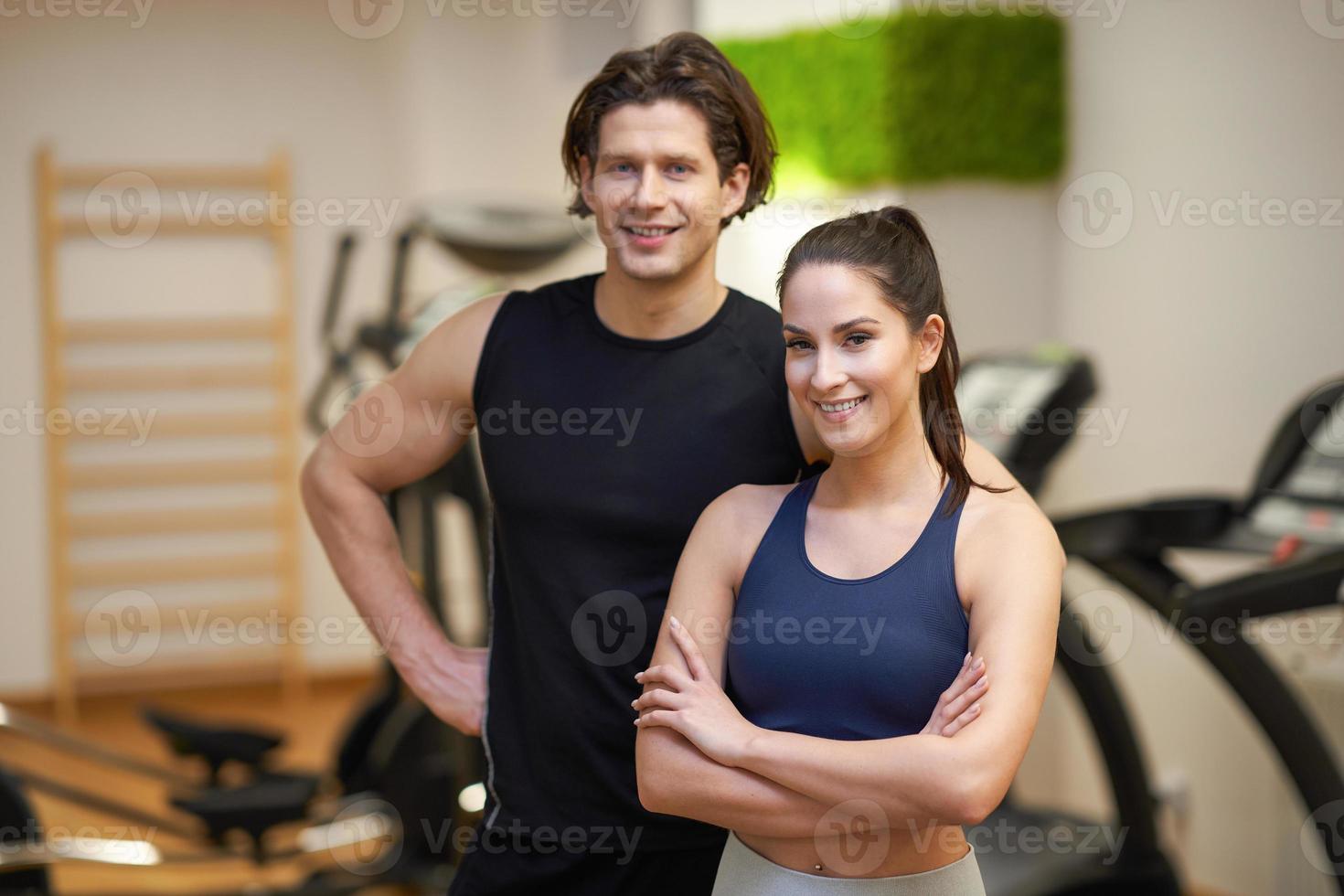 Fit couple at the gym looking very attractive photo