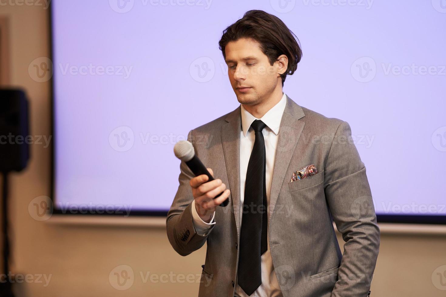 Businessman having speech during conference photo