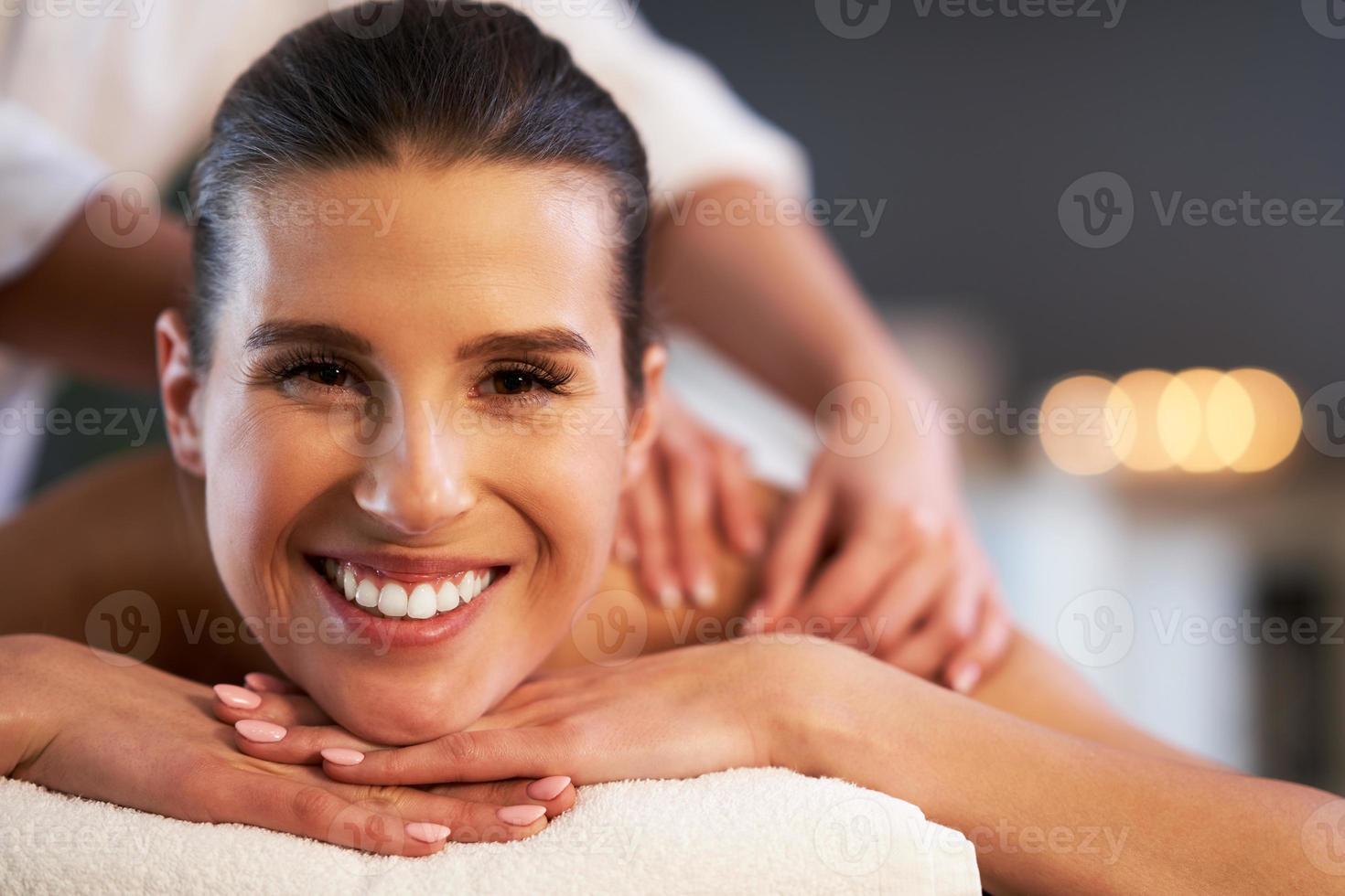 Relaxed woman receiving back massage 15858486 Stock Photo at Vecteezy