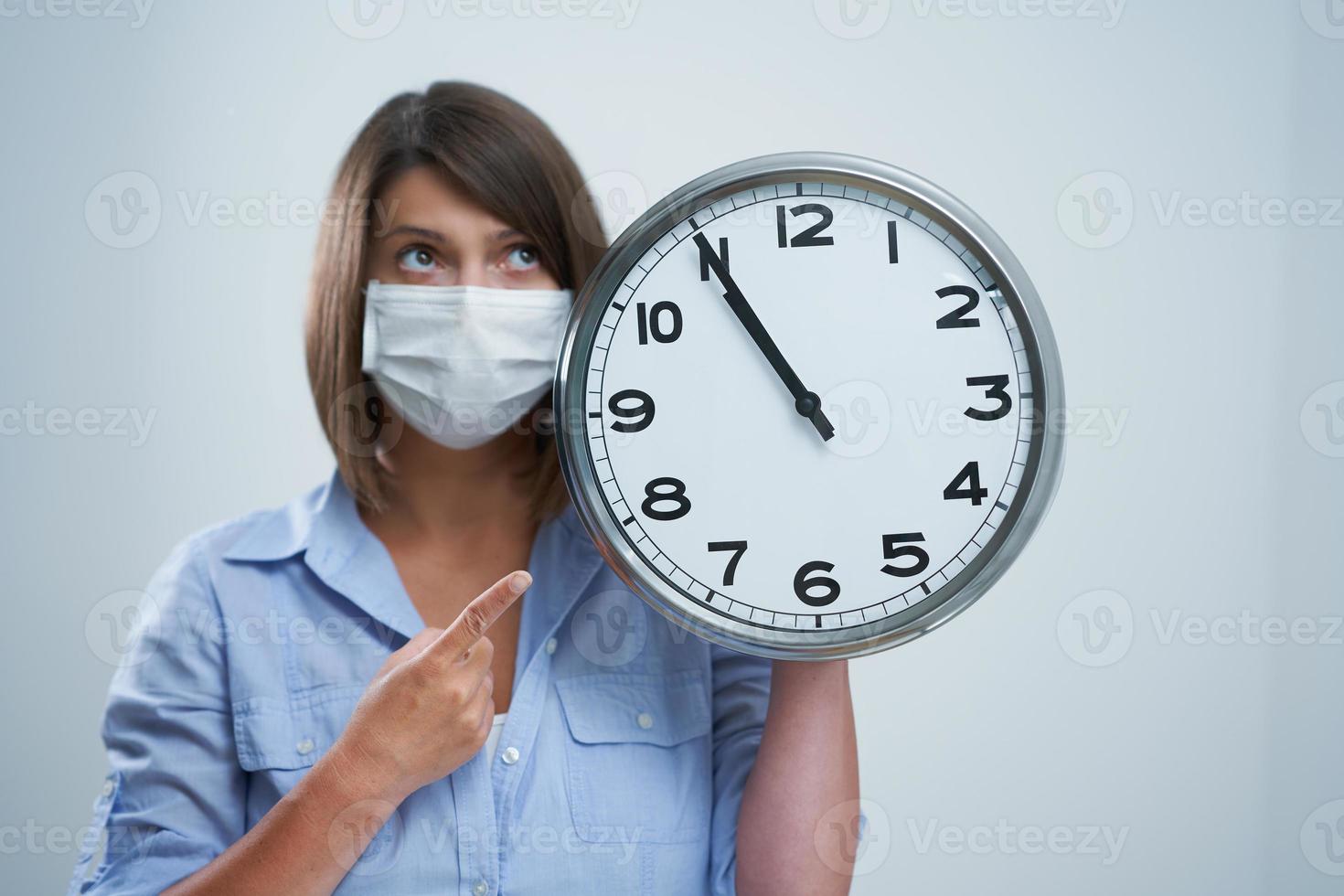 Attractive woman wearing protective mask isolated over white background photo