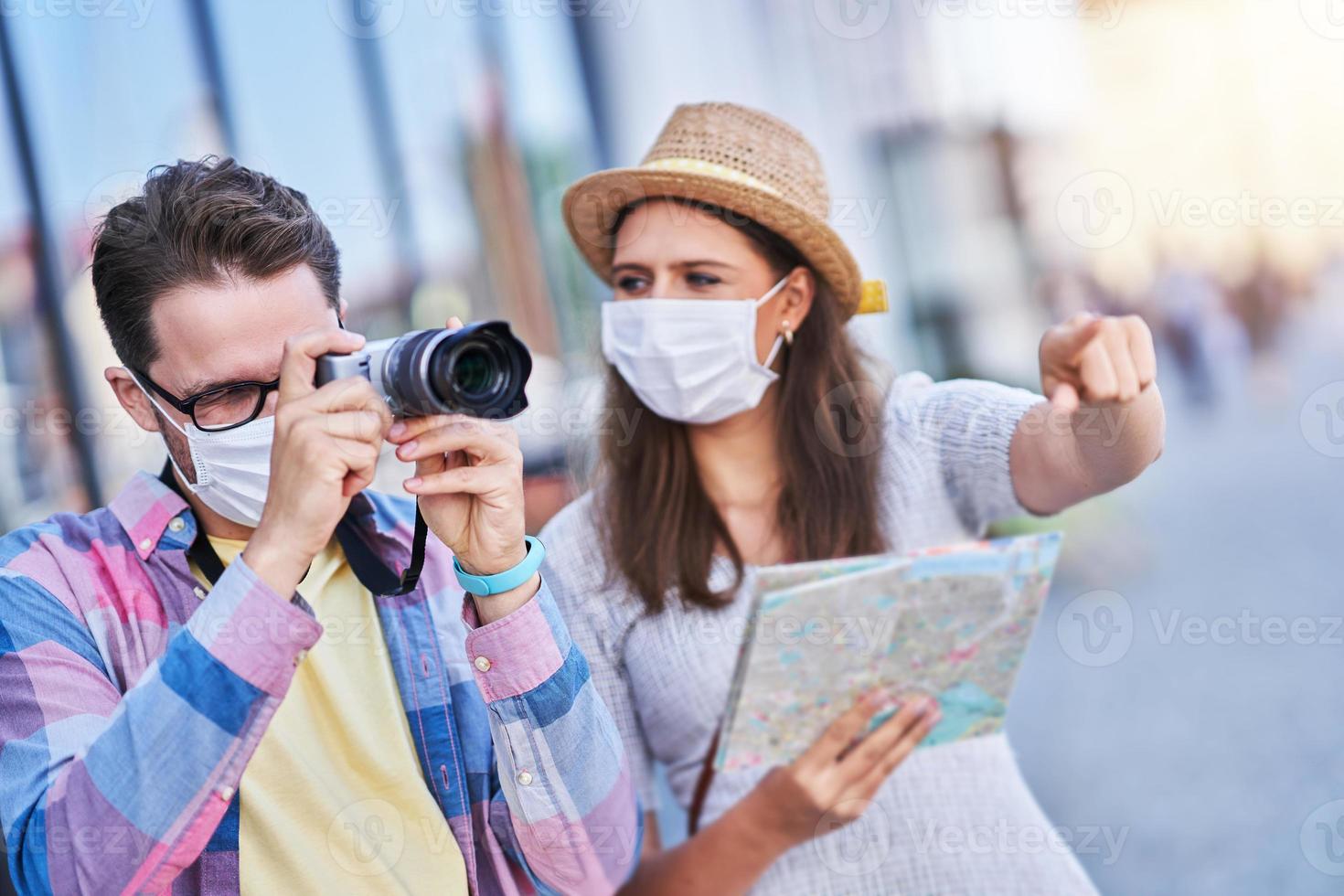 Adult tourists in masks sightseeing Gdansk Poland photo