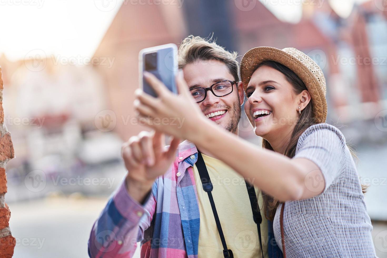 Adult happy tourists sightseeing Gdansk Poland in summer photo