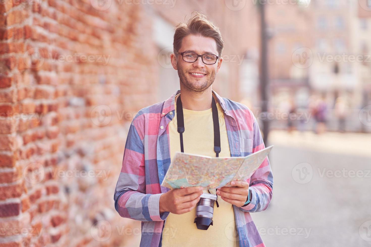 Male tourist in mask sightseeing Gdansk Poland photo