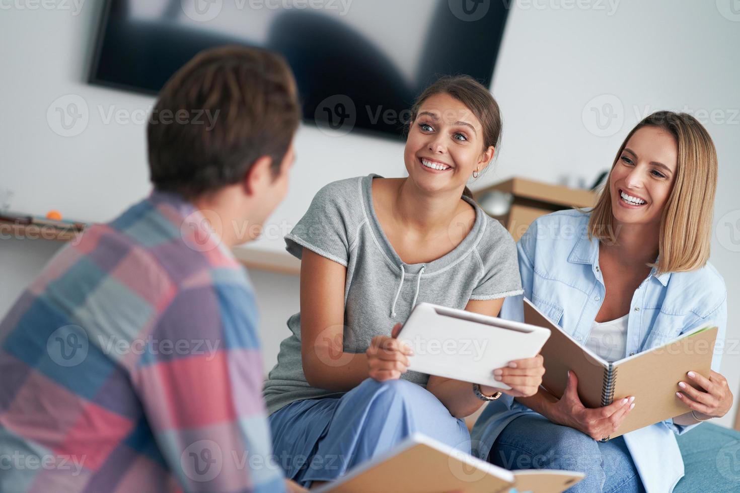 Group of students studying together in the campus photo
