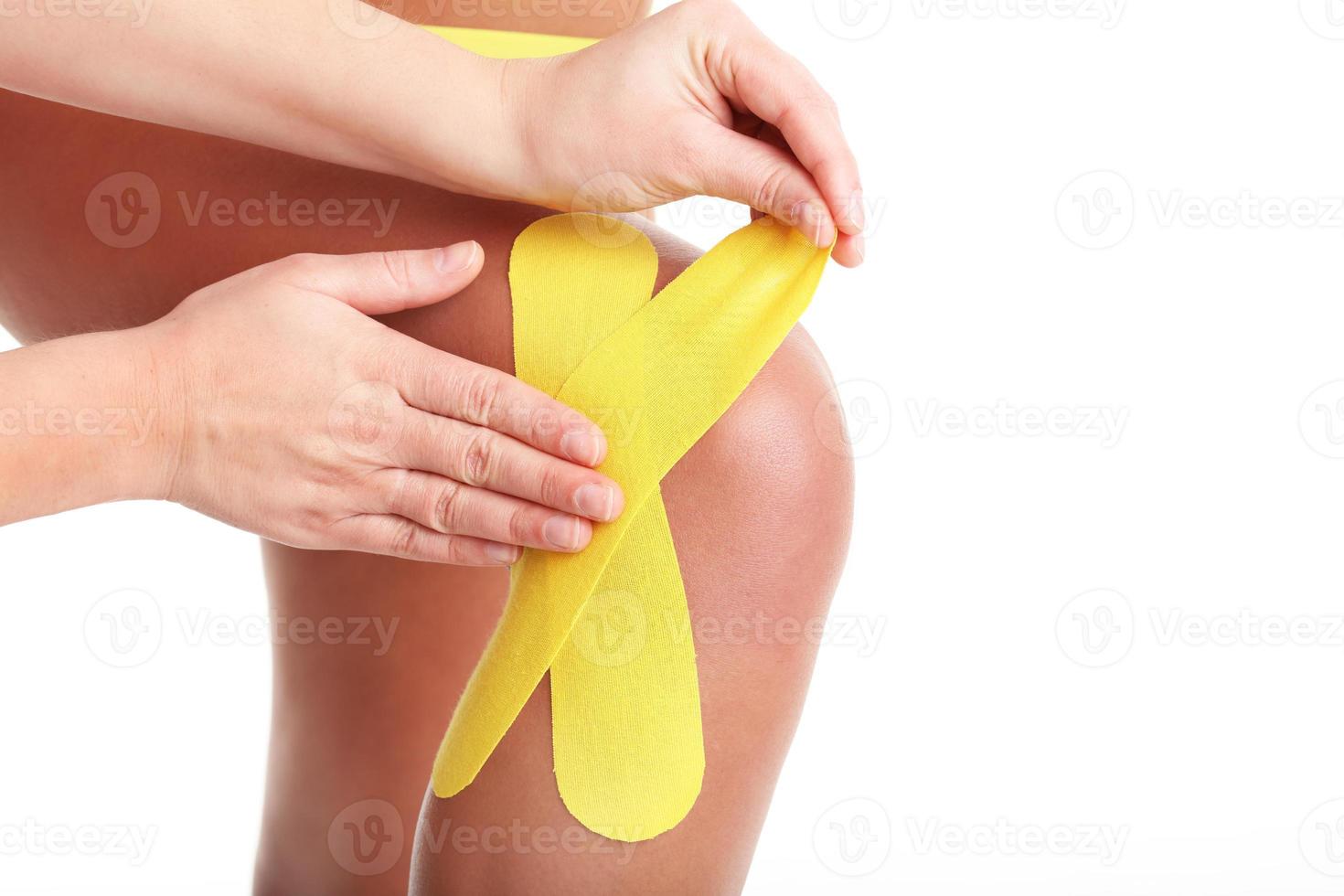 Female body with KT tape photo