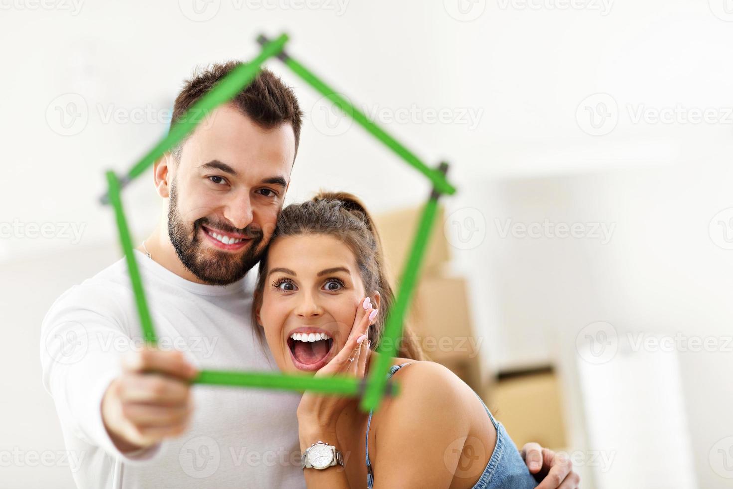 Happy adult couple moving out or in to new home photo