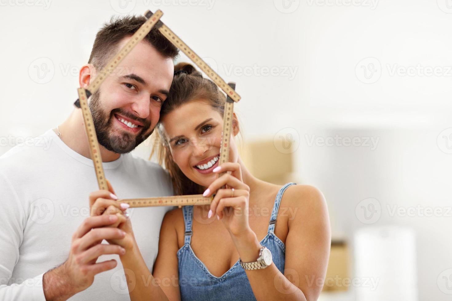 Happy adult couple moving out or in to new home photo